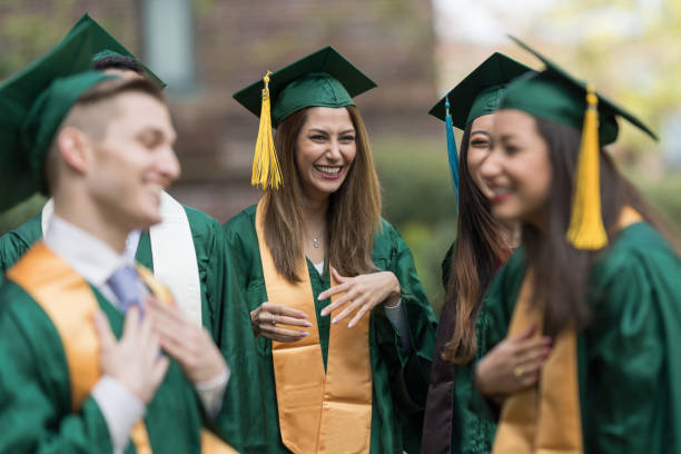 istock College graduates celebrating and talking together 1165006574