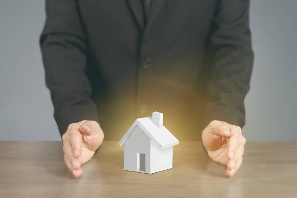 istock Concept by house from in hand 1165014883