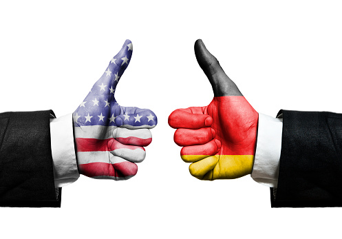 Two businessman hands with thumbs up and flag of USA and GERMANY - COOPERATION - message / Flag concept (Click for more)
