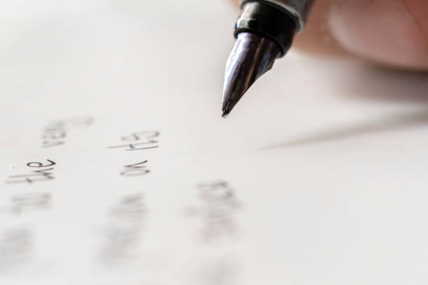 istock macro shot of fountain pen writing on white surface 1165019420