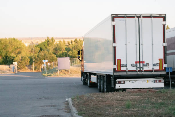 istock huge truck with wagon delivering some package outdoor 1165019566