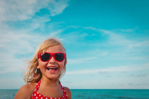 happy cute smiling girl at summer beach vacation