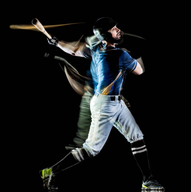 istock baseball player man isolated black background light painting 1165021418
