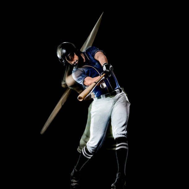 istock baseball player man isolated black background light painting 1165021442