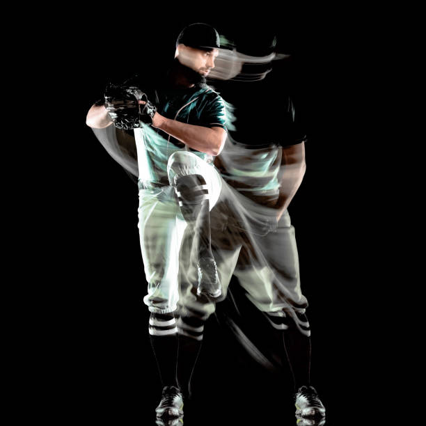 istock baseball player man isolated black background light painting 1165021447
