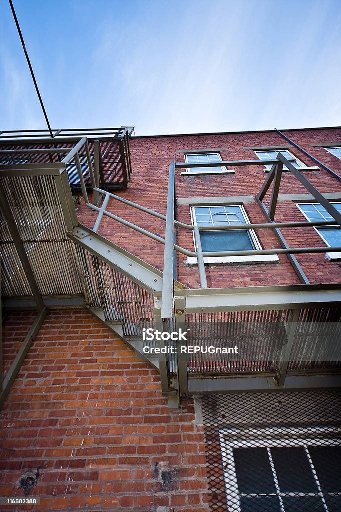 Old brick building A old brick building shot from a low perspective. Brick Stock Photo