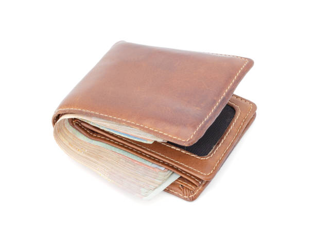 istock brown wallet with money isolated 1165028716
