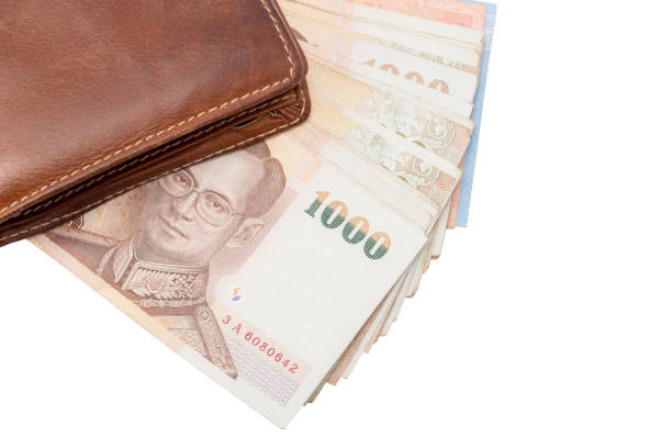 istock brown wallet with money isolated 1165028718