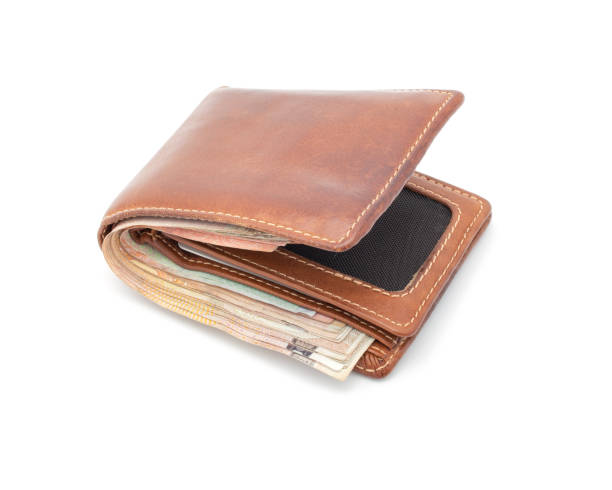 istock brown wallet with money isolated 1165028781