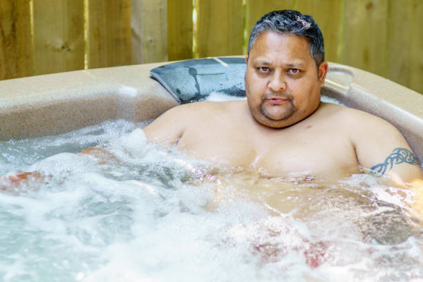 istock Mature man in hot tub 1165038527