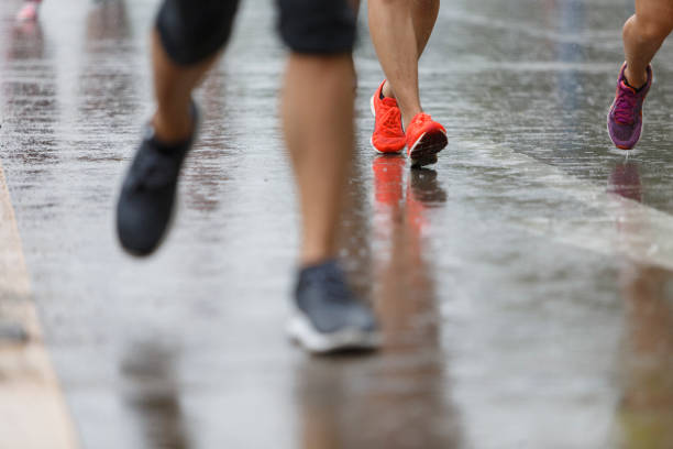 istock Marathon runners on the road the day it rained. 1165038539