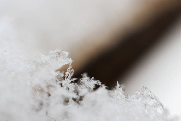 istock snow flake macro closeup on old windowsill, space for text. snowy winter. seasonal time 1165040513