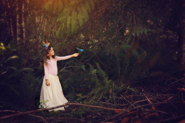 istock 5 year old girl in forest with a butterfly 1165042253
