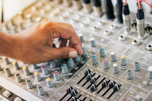 istock People controlling the sound, blurred scenes 1165043238