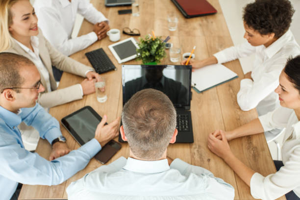 istock Business meeting by multi-ethnic group 1165043583