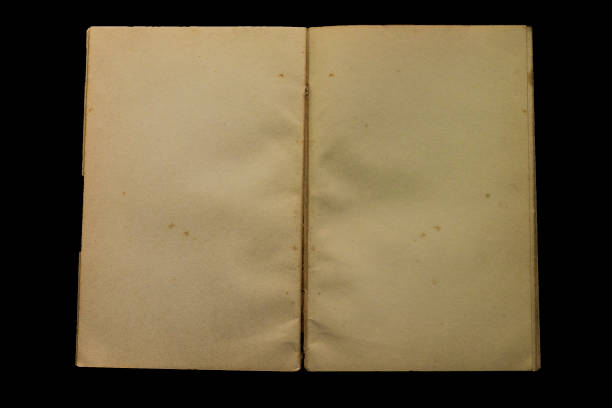istock old and vintage open blank page note book with isolated black background 1165044343