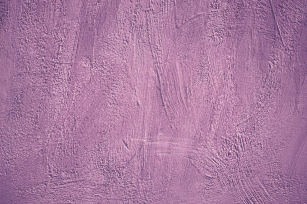 istock Acrylic painted wall. Purple background. Abstract pink pattern. Creative violet card in modern style. Weathered template, grunge backdrop. Textured concrete wall surface. 1165044587