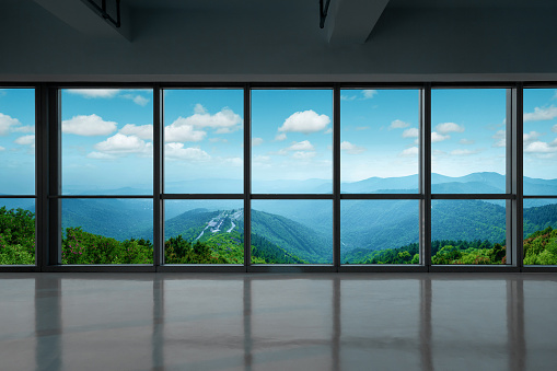 Window with lush green panoramic landscape
