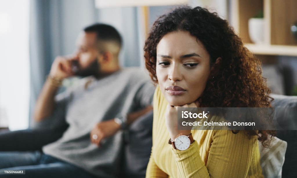 This relationship is not working for me anymore Shot of a young couple having a disagreement at home Couple - Relationship Stock Photo