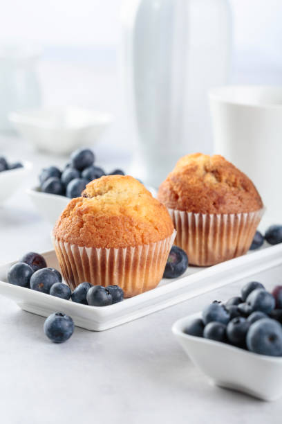 istock Muffins and blueberry on white table. 1165049491