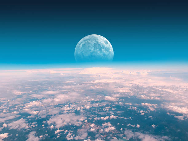 istock Half Moon rising from the Earth horizon above the clouds. My astronomy work. 1165051324