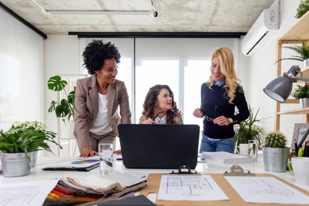 istock Three multiethnic woman working at the office in front of laptop 1165052152
