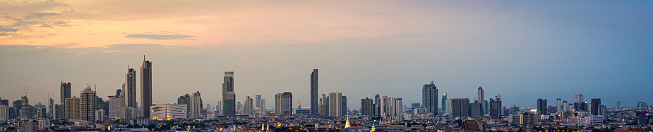 Panorama High rise office building The city centre of Bangkok. At dawn, the light from the sky is orange.
