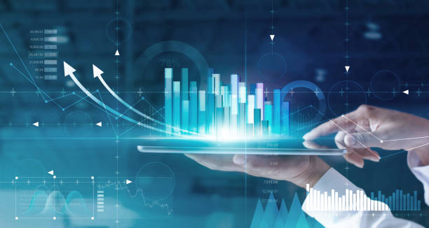 istock Hands of businessman analyzing sales data and economic growth graph chart on tablet and hologram screen. Business strategy and digital data, business technology, digital marketing. 1165053279