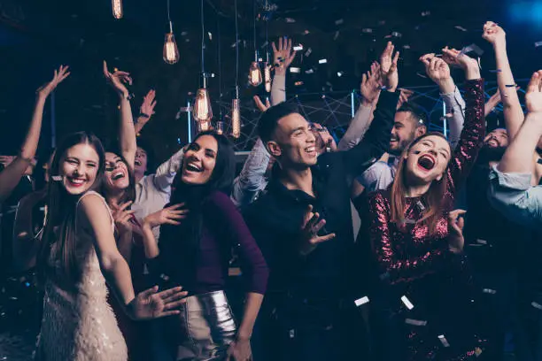 Portrait cute attractive lovely youth millennial person laugh excited, funny funky motion having fun free time raise fists formal wear suit dress fashionable modern magnificent indoors dance floor