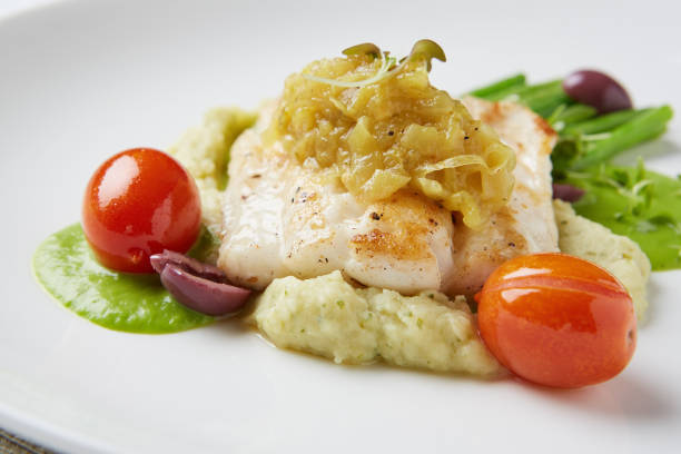 istock Close-up of fish entree at fine dining restaurant 1165053819