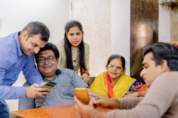 istock Family time with discussion on various mobile apps 1165053927