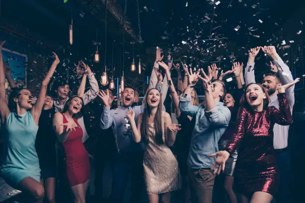 Nice-looking attractive gorgeous glamorous elegant stylish cheerful cheery, positive girls and guys having fun bachelor graduate occasion in fashionable luxury place night-club indoors