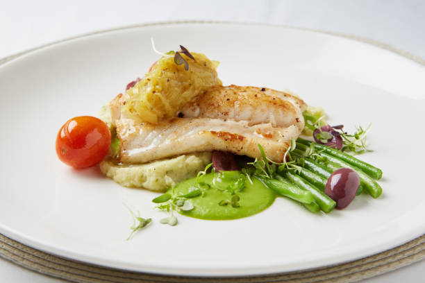 istock Gourmet fish dish at fine dining restaurant 1165056359