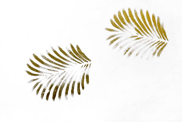 istock Abstract palm leaves golden print on stucco surface. 1165056632