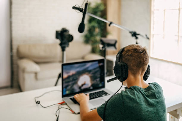 istock Kid recording his gameplay for vlog 1165059520
