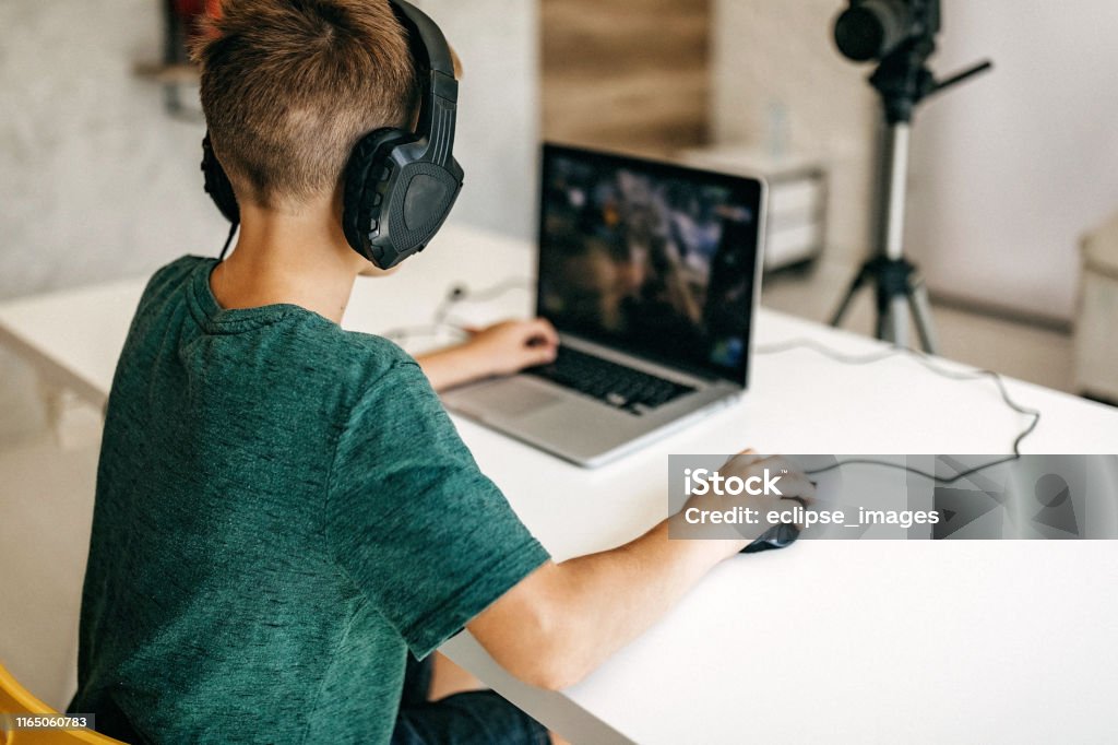 Kid recording his gameplay for vlog Child Stock Photo