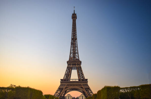 istock Eiffel Tower in Paris At sunset with blue and Yellow Sky 1165063756