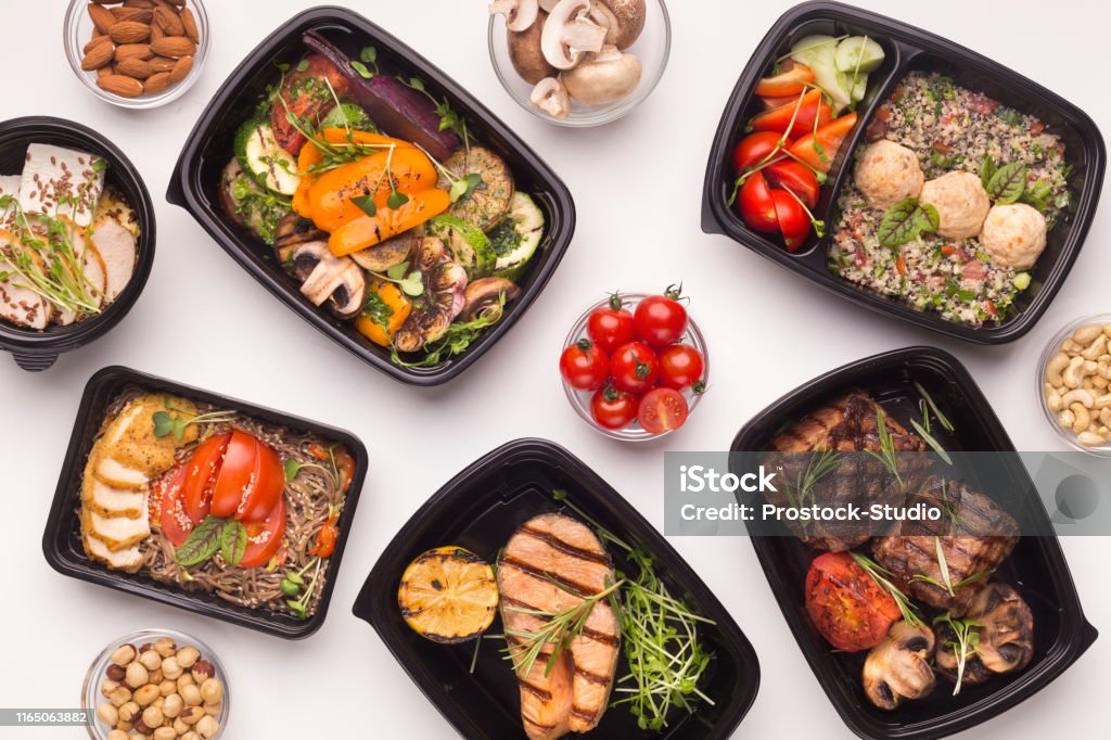 Restaurant healthy food delivery in take away boxes Restaurant healthy food delivery in take away boxes for daily nutrition on white background Food Stock Photo