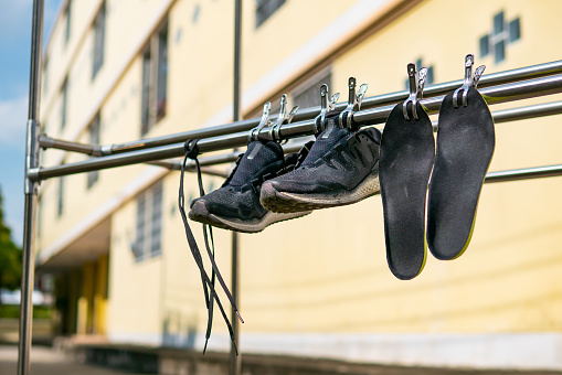 Running shoes hanging under the sun