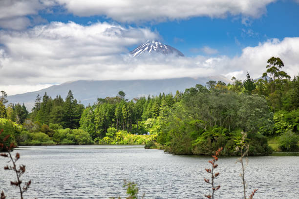 istock volcano Taranaki covered in clouds, New Zealand 1165065666