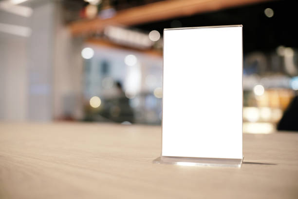 istock Mock up Menu frame standing on wood table in Bar restaurant cafe. space for text 1165067036