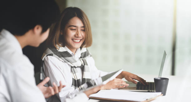 istock Young asian business partner discussing 1165067260
