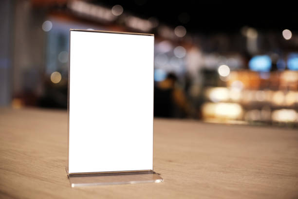 istock Mock up Menu frame standing on wood table in Bar restaurant cafe. space for text 1165067538