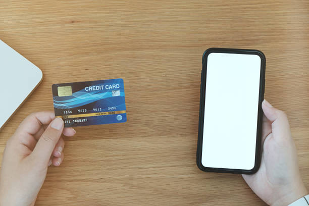 istock Woman paying with credit card online orders the Internet. and making transaction using mobile bank application. . 1165067671