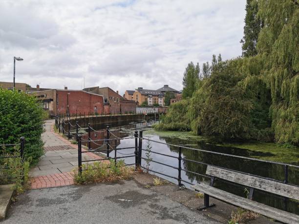 istock English river with iron bridge and willows 1165067942