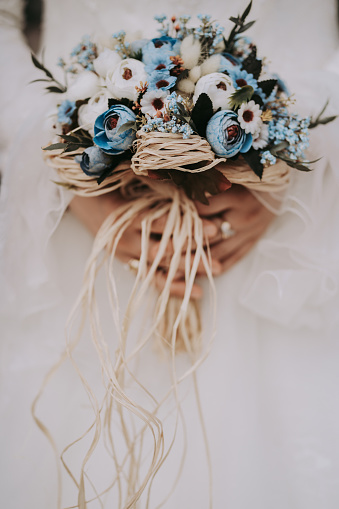 Unrecognizable bride holding bridal bouquet.Wedding bouquet in hands of bride