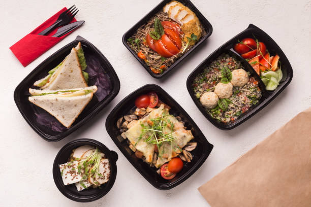 istock Healthy food in black boxes with daily ration 1165072123