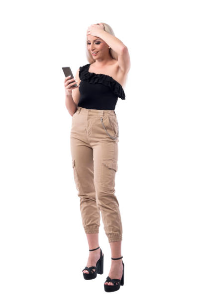 istock Relieved young woman with hand on forehead using smart phone. 1165073234