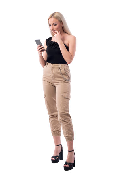 istock Anxious nervous young blonde beautiful woman biting nails while using mobile phone. 1165073315