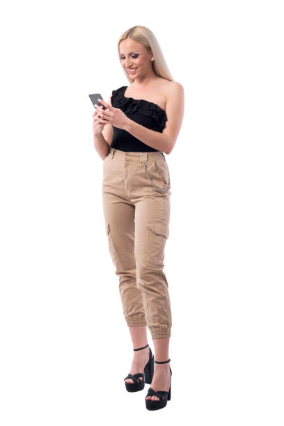 istock Happy smiling blonde stylish woman using mobile phone typing message. 1165073493